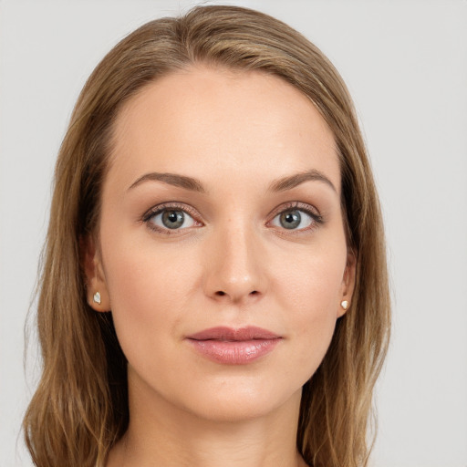 Joyful white young-adult female with long  brown hair and grey eyes