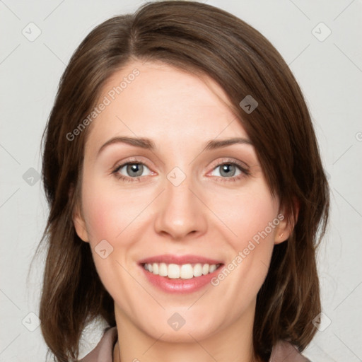 Joyful white young-adult female with medium  brown hair and green eyes