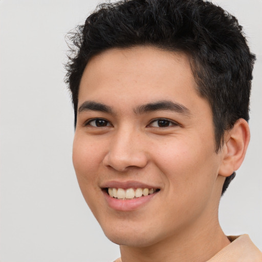Joyful asian young-adult male with short  brown hair and brown eyes