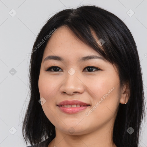 Joyful asian young-adult female with medium  black hair and brown eyes