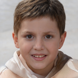 Joyful white child male with short  brown hair and brown eyes