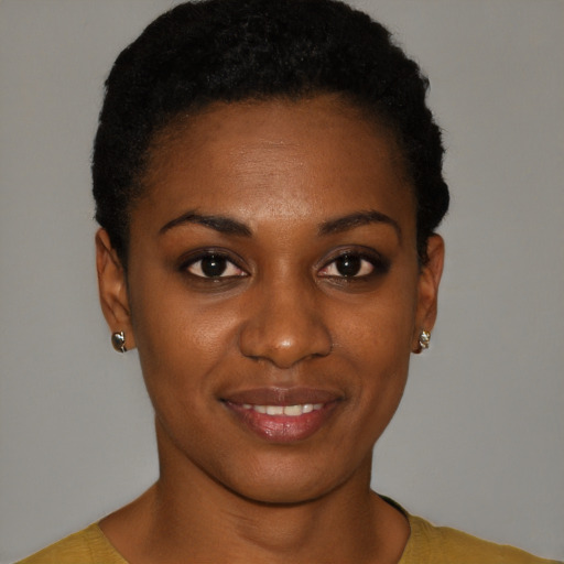 Joyful black young-adult female with short  black hair and brown eyes