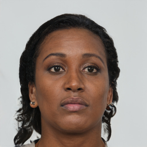 Neutral black adult female with medium  brown hair and brown eyes