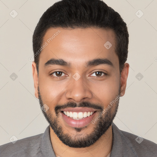 Joyful latino young-adult male with short  black hair and brown eyes