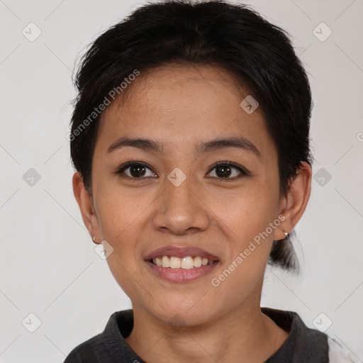 Joyful asian young-adult female with short  brown hair and brown eyes