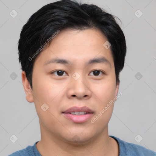 Joyful asian young-adult male with short  black hair and brown eyes