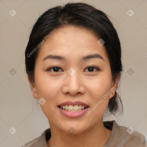 Joyful asian young-adult female with medium  black hair and brown eyes