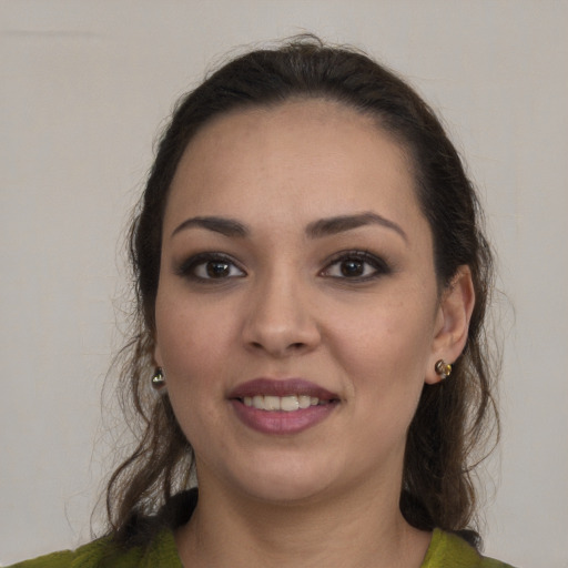 Joyful white young-adult female with medium  brown hair and brown eyes