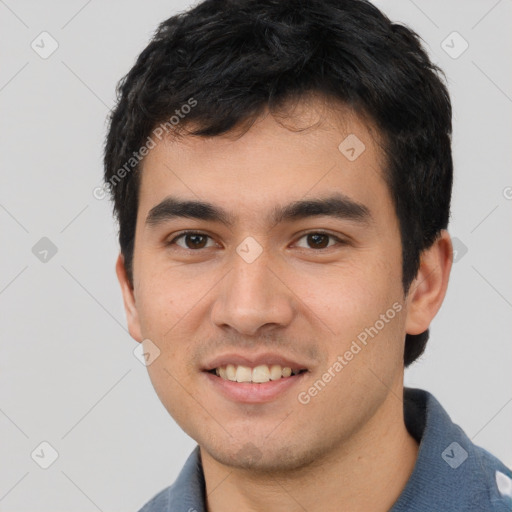 Joyful white young-adult male with short  black hair and brown eyes