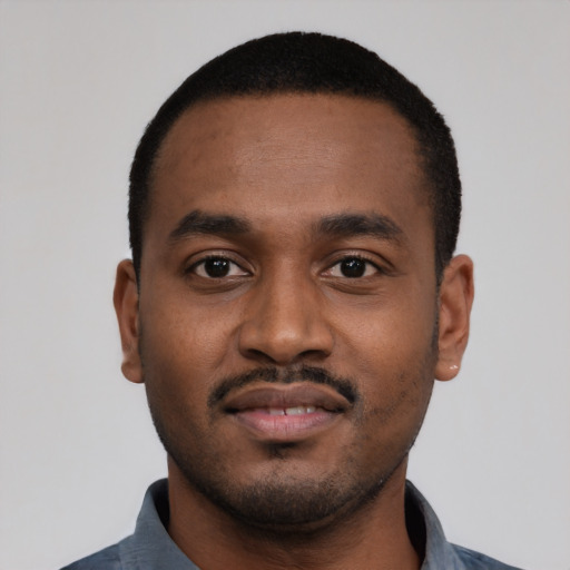 Neutral black young-adult male with short  black hair and brown eyes