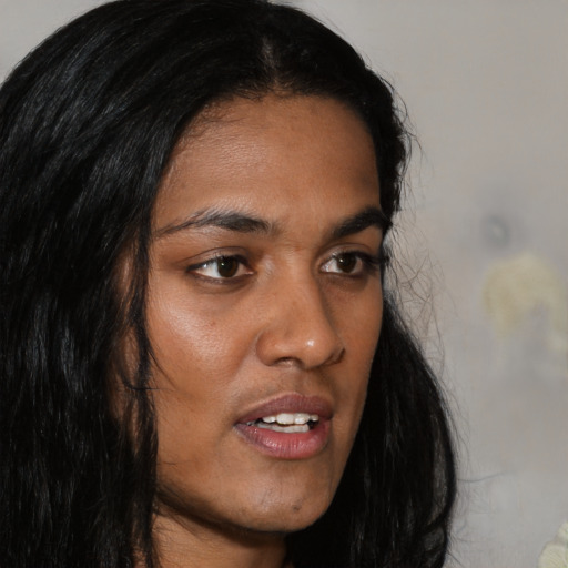 Neutral black young-adult female with long  brown hair and brown eyes