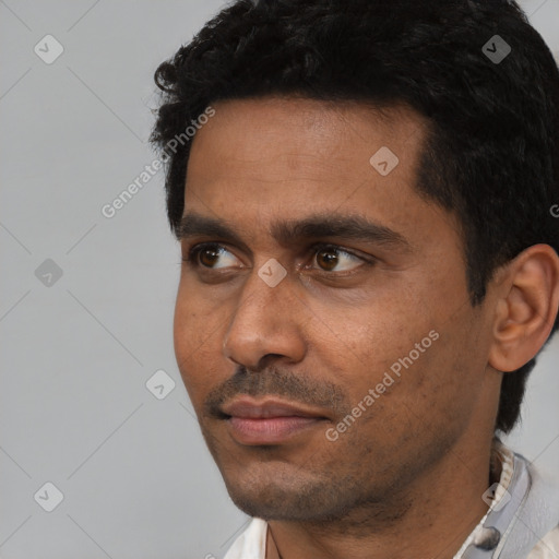 Neutral latino young-adult male with short  black hair and brown eyes