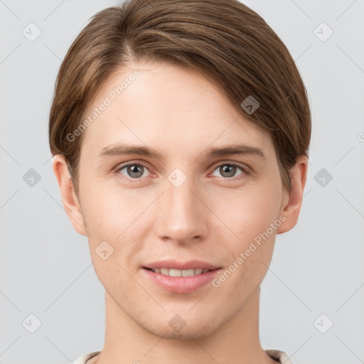 Joyful white young-adult female with short  brown hair and grey eyes