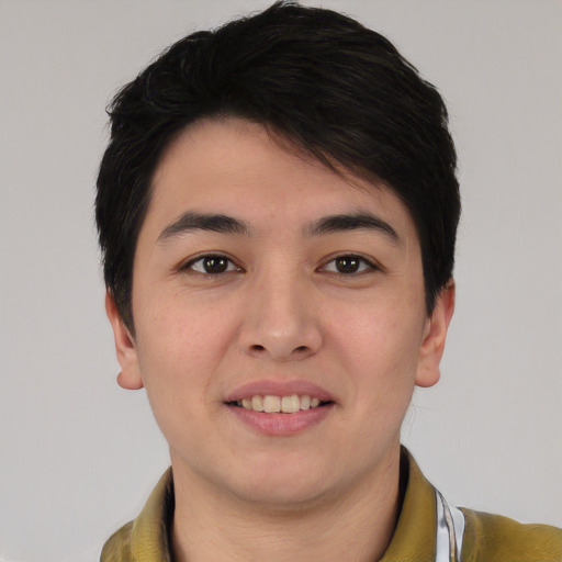 Joyful asian young-adult male with short  brown hair and brown eyes