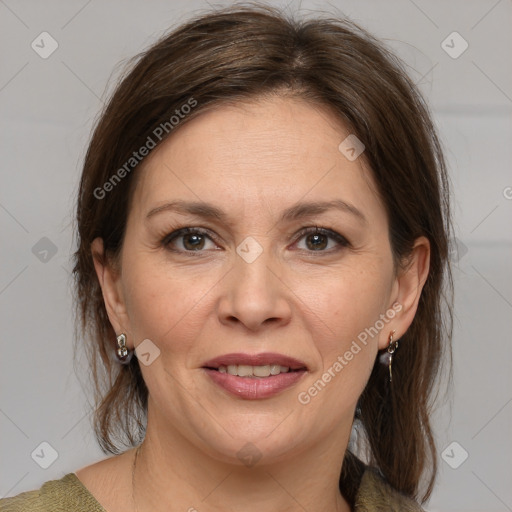 Joyful white adult female with medium  brown hair and grey eyes