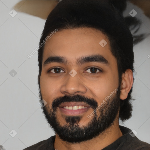 Joyful latino young-adult male with short  black hair and brown eyes