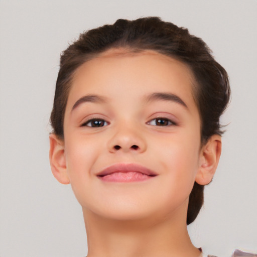 Joyful white child female with short  brown hair and brown eyes