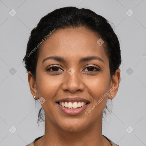 Joyful latino young-adult female with short  black hair and brown eyes