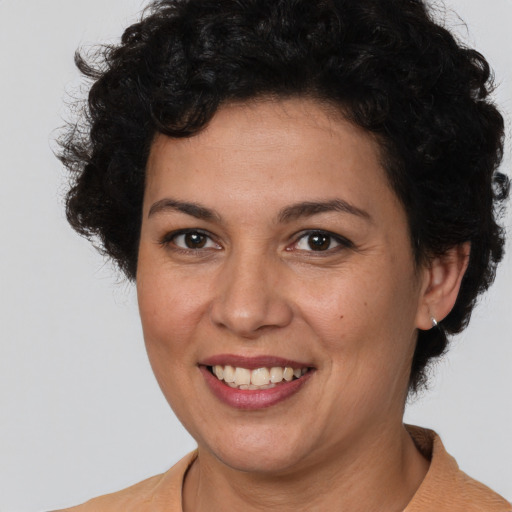 Joyful white adult female with short  brown hair and brown eyes