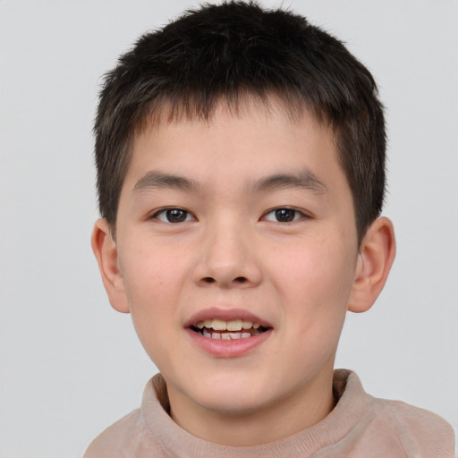 Joyful white child male with short  brown hair and brown eyes