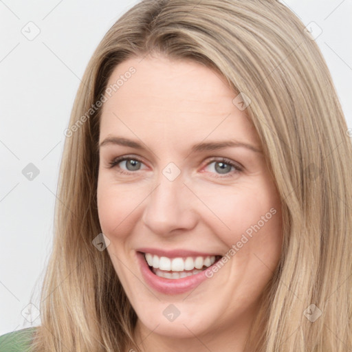 Joyful white young-adult female with long  brown hair and grey eyes