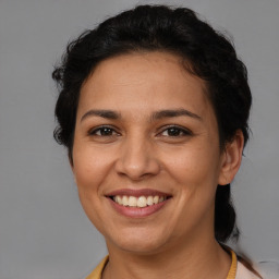 Joyful white adult female with short  brown hair and brown eyes