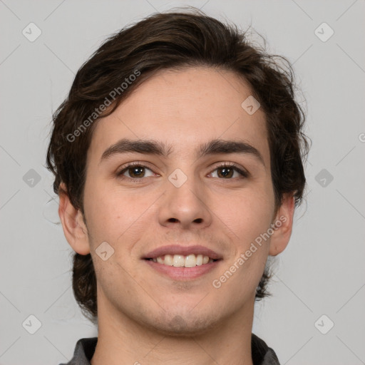 Joyful white young-adult male with medium  brown hair and brown eyes