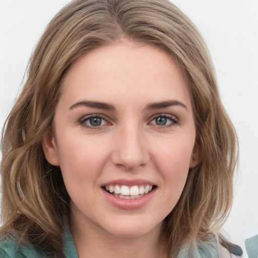 Joyful white young-adult female with long  brown hair and green eyes