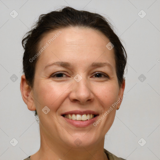 Joyful white adult female with short  brown hair and brown eyes