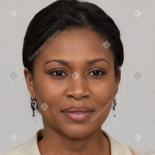 Joyful black young-adult female with short  brown hair and brown eyes