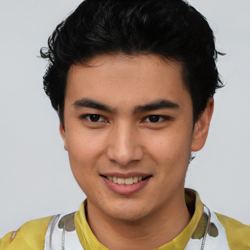Joyful latino young-adult male with short  brown hair and brown eyes
