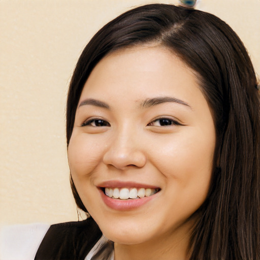 Joyful white young-adult female with long  black hair and brown eyes