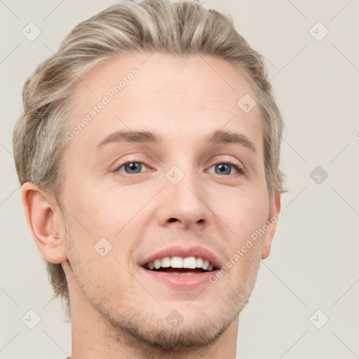 Joyful white adult male with short  brown hair and grey eyes