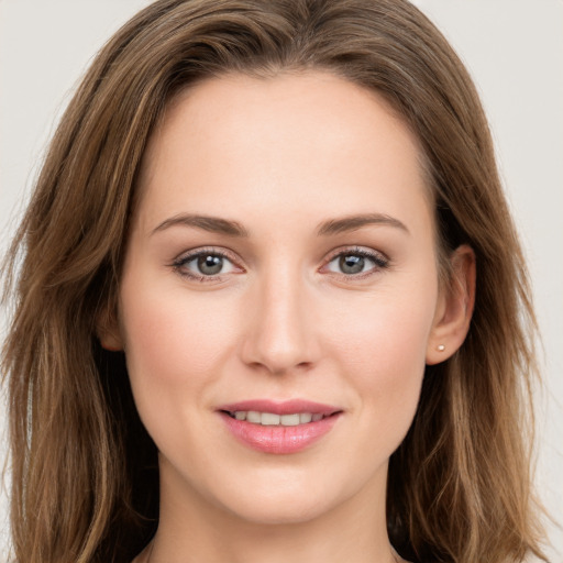 Joyful white young-adult female with long  brown hair and grey eyes