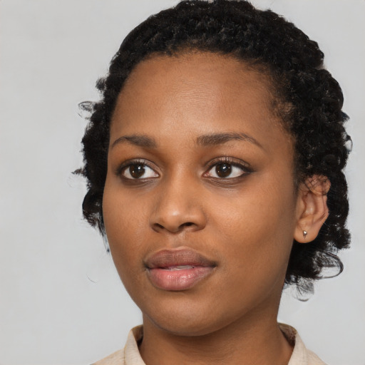 Neutral black young-adult female with short  black hair and brown eyes
