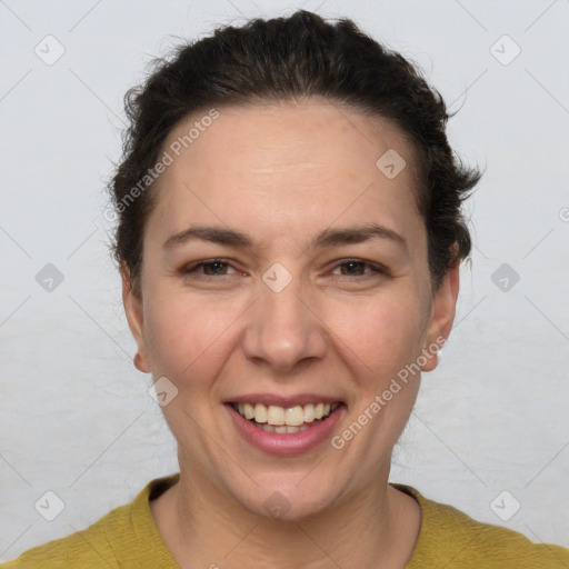 Joyful white adult female with short  brown hair and brown eyes