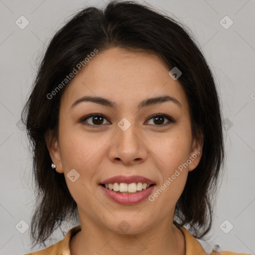 Joyful latino young-adult female with medium  brown hair and brown eyes