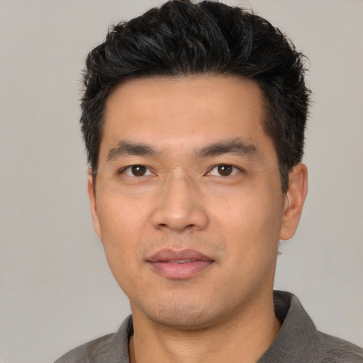 Neutral asian young-adult male with short  black hair and brown eyes