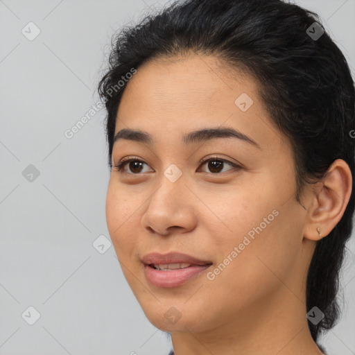 Joyful asian young-adult female with medium  black hair and brown eyes