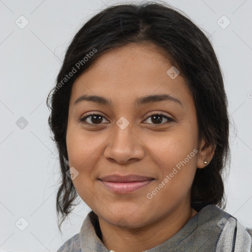 Joyful latino young-adult female with medium  brown hair and brown eyes