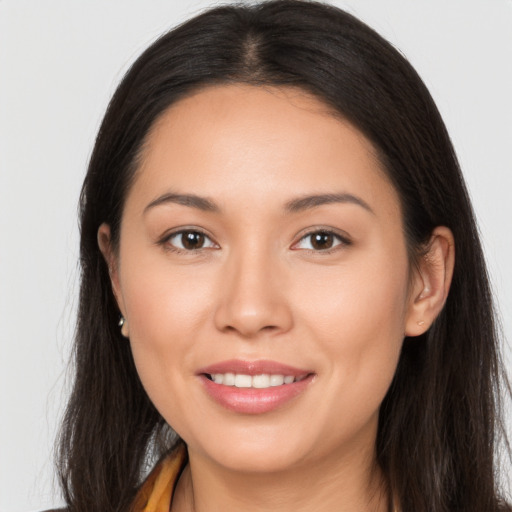 Joyful white young-adult female with long  brown hair and brown eyes