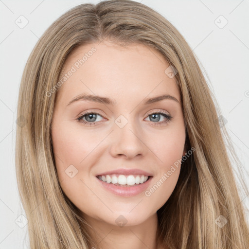 Joyful white young-adult female with long  brown hair and green eyes