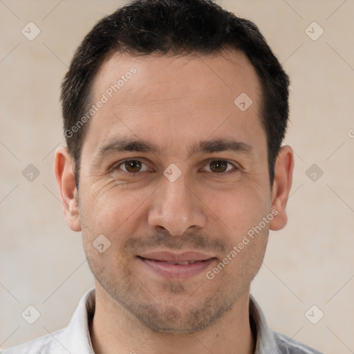 Joyful white adult male with short  brown hair and brown eyes