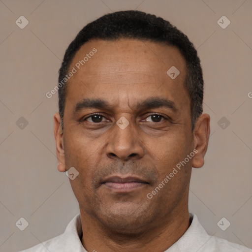 Neutral latino adult male with short  black hair and brown eyes