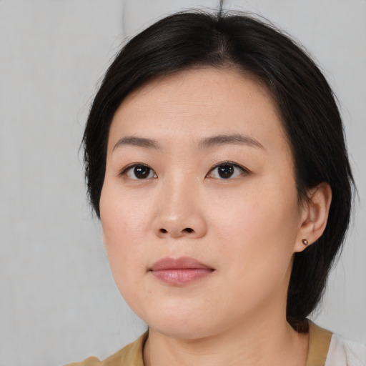Neutral asian young-adult female with medium  black hair and brown eyes