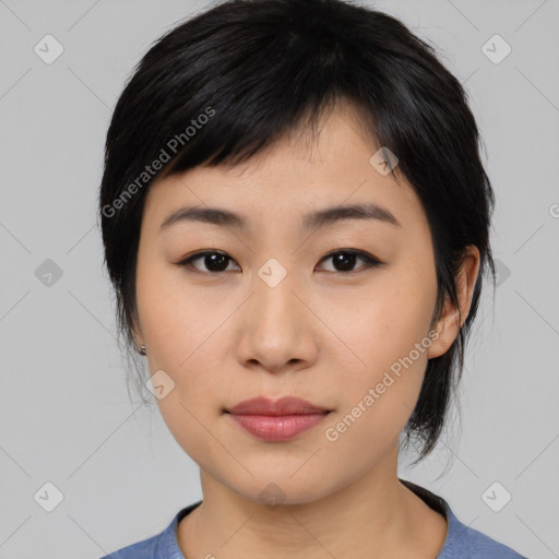 Joyful asian young-adult female with medium  black hair and brown eyes