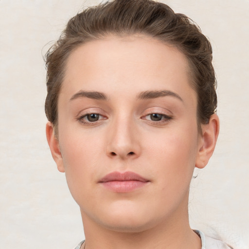 Neutral white young-adult female with short  brown hair and brown eyes