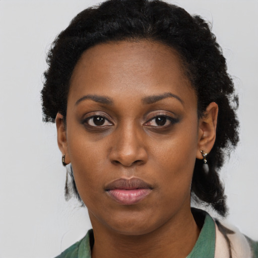 Neutral black adult female with short  black hair and brown eyes