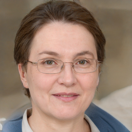 Joyful white adult female with short  brown hair and blue eyes