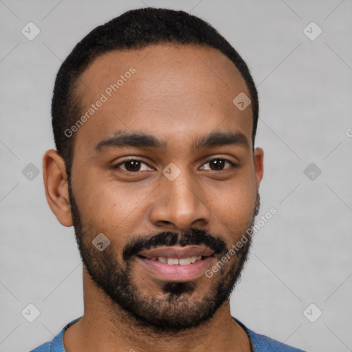 Joyful black young-adult male with short  brown hair and brown eyes